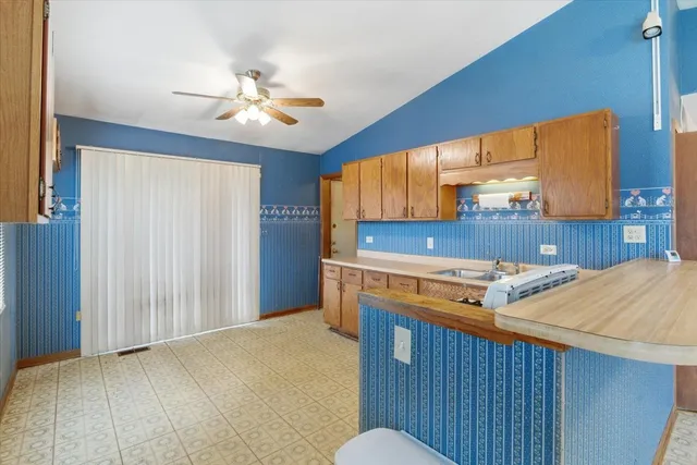 a view of wooden floor and a window