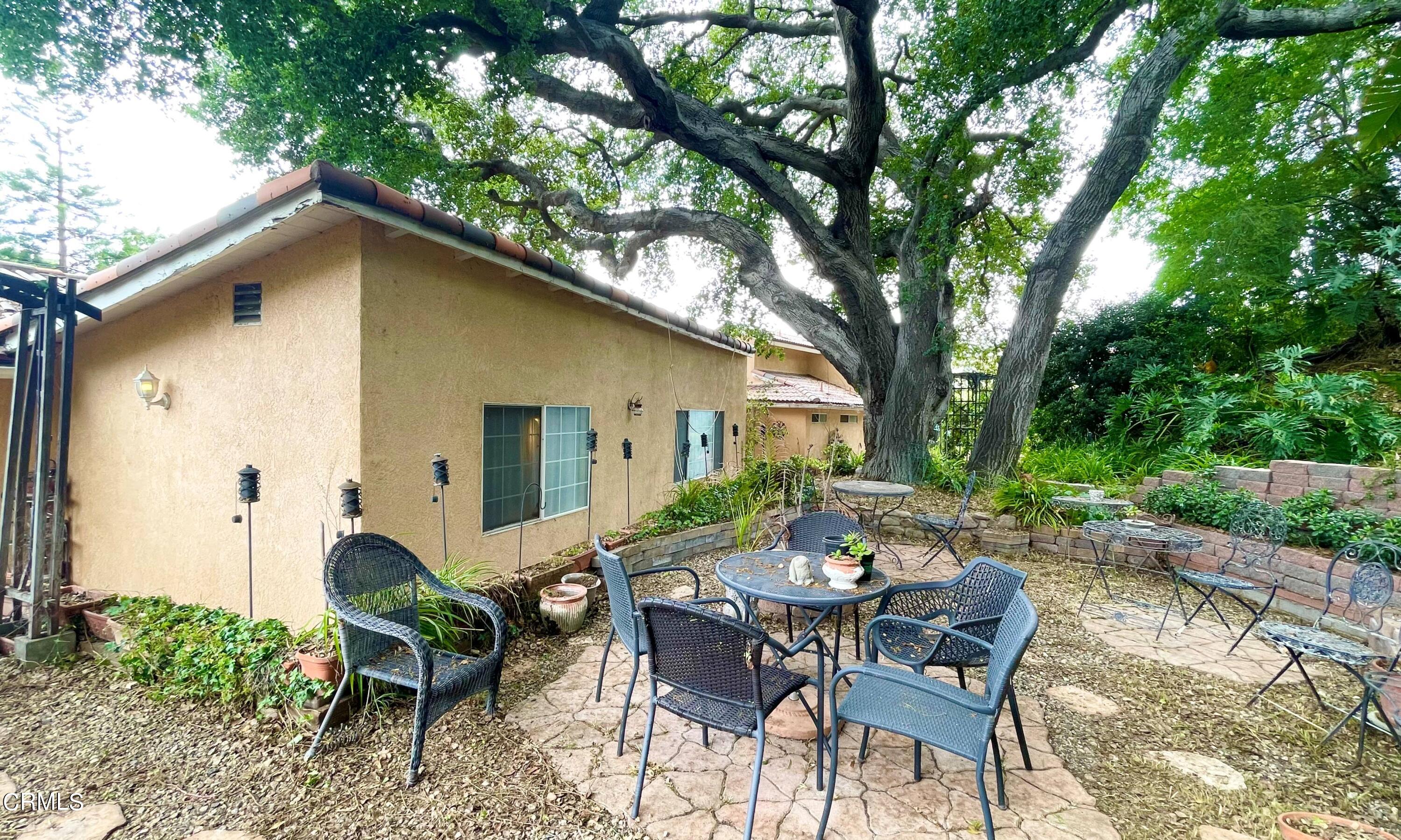 930 Sherlock Drive Burbank, CA 91501 - Photo 13 of 21 a view of a patio with a table and chairs in a patio