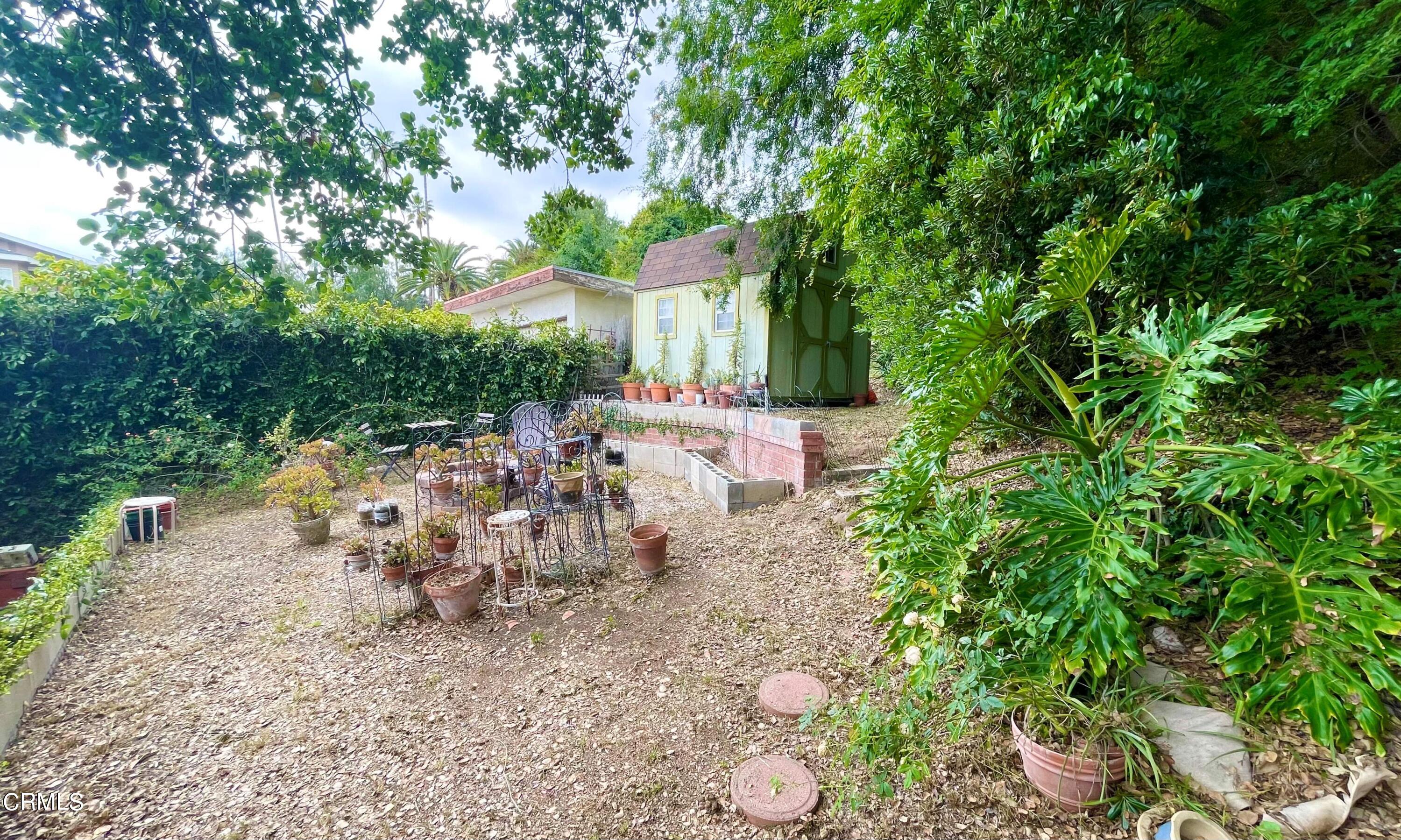 930 Sherlock Drive Burbank, CA 91501 - Photo 14 of 21 a view of a table and chairs in the garden