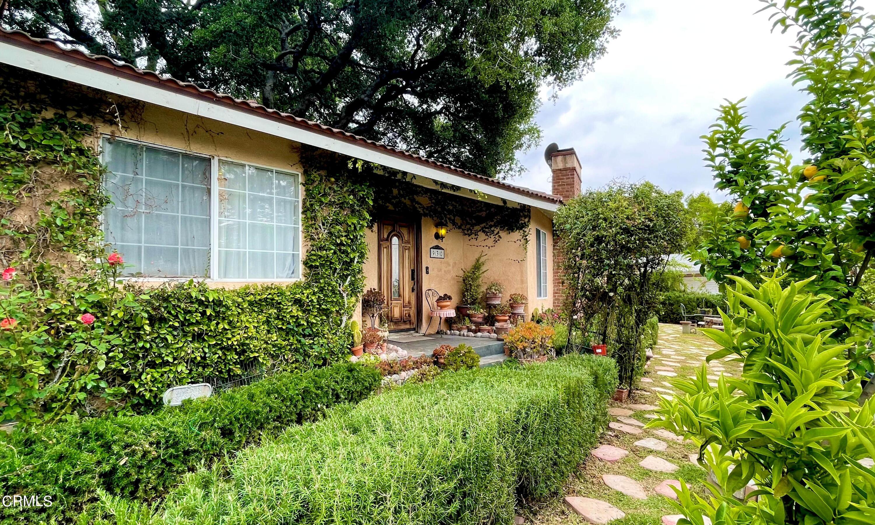 930 Sherlock Drive Burbank, CA 91501 - Photo 3 of 21 a backyard of a house with chairs and a small yard