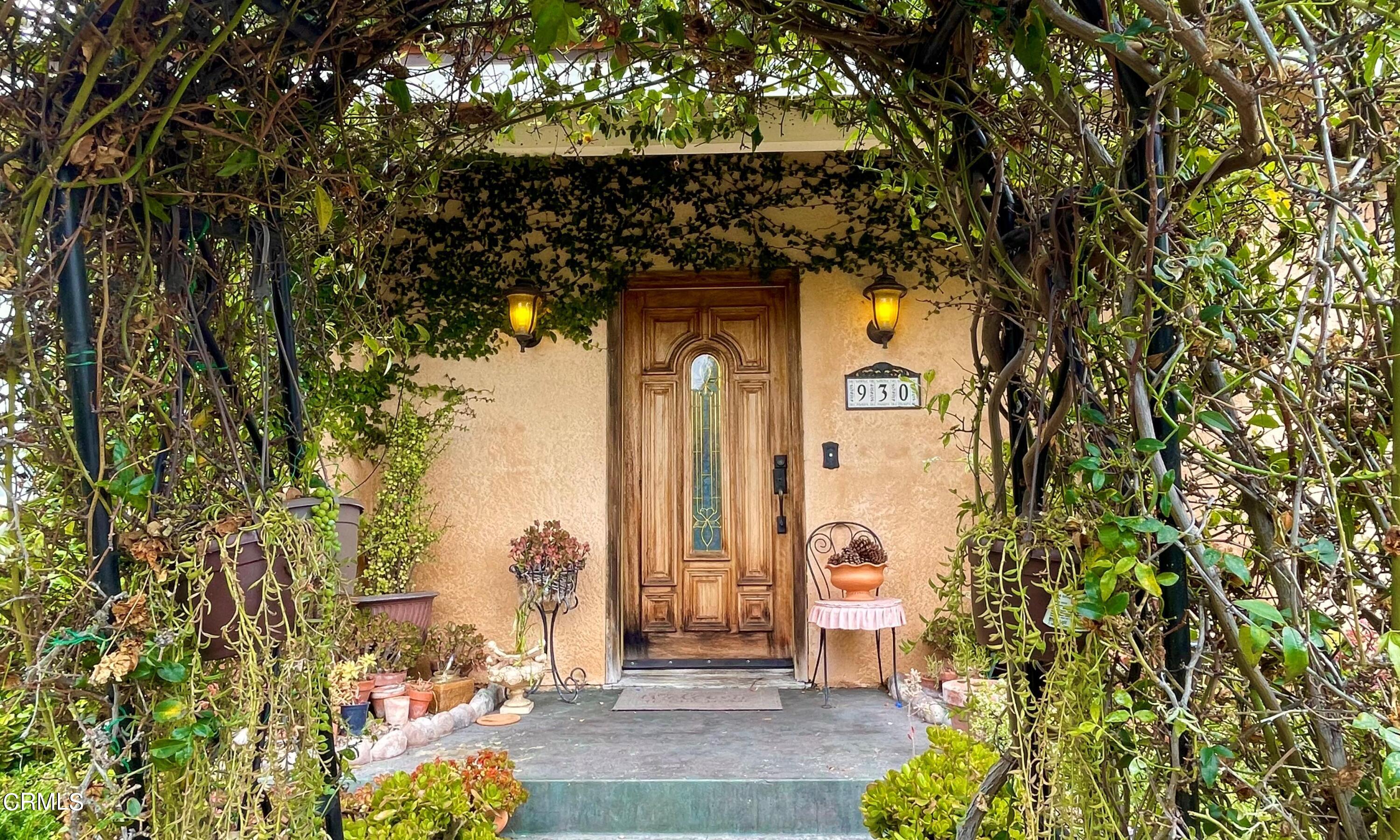 930 Sherlock Drive Burbank, CA 91501 - Photo 4 of 21 a front view of a house with a trees
