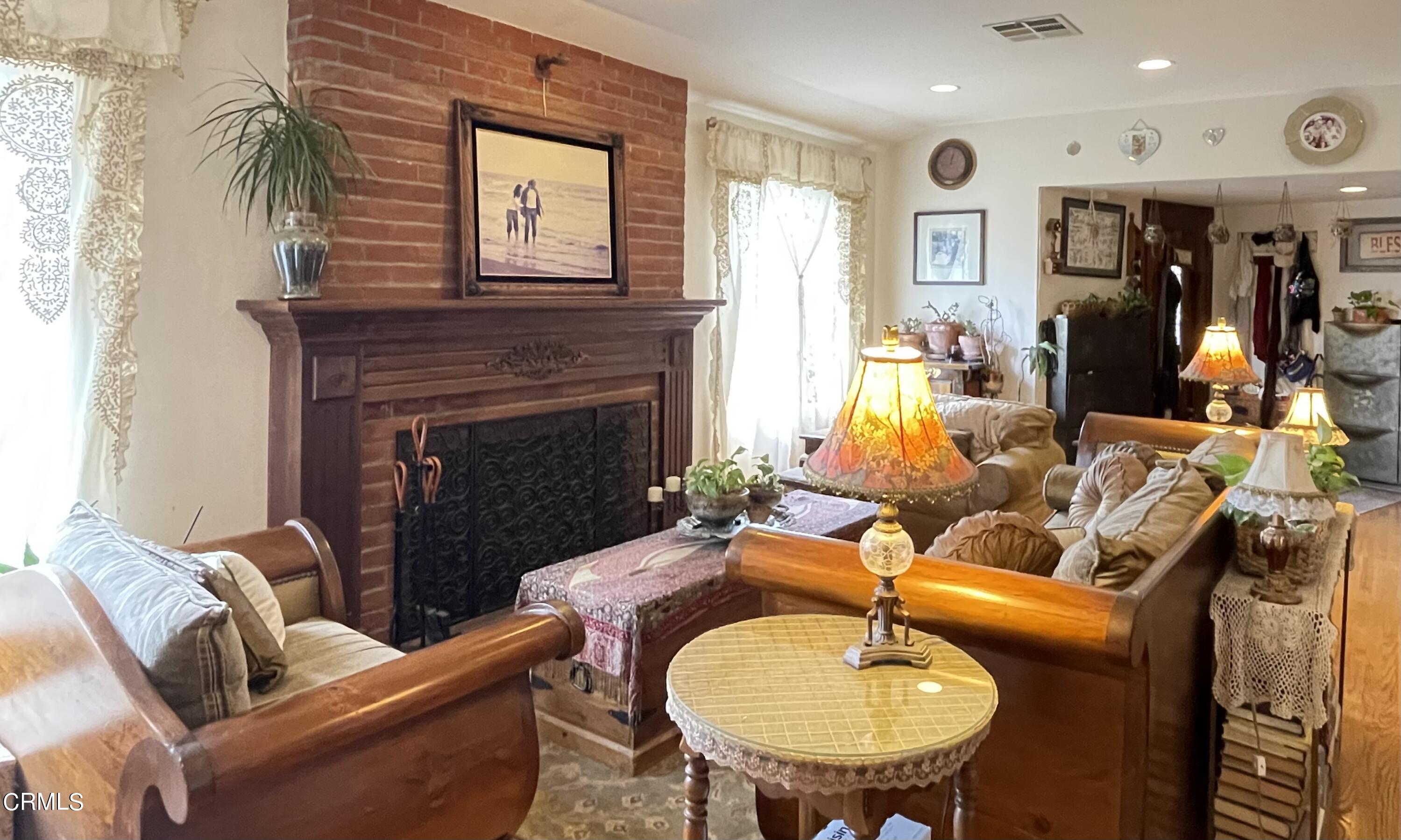 930 Sherlock Drive Burbank, CA 91501 - Photo 6 of 21 a living room with furniture and a fireplace