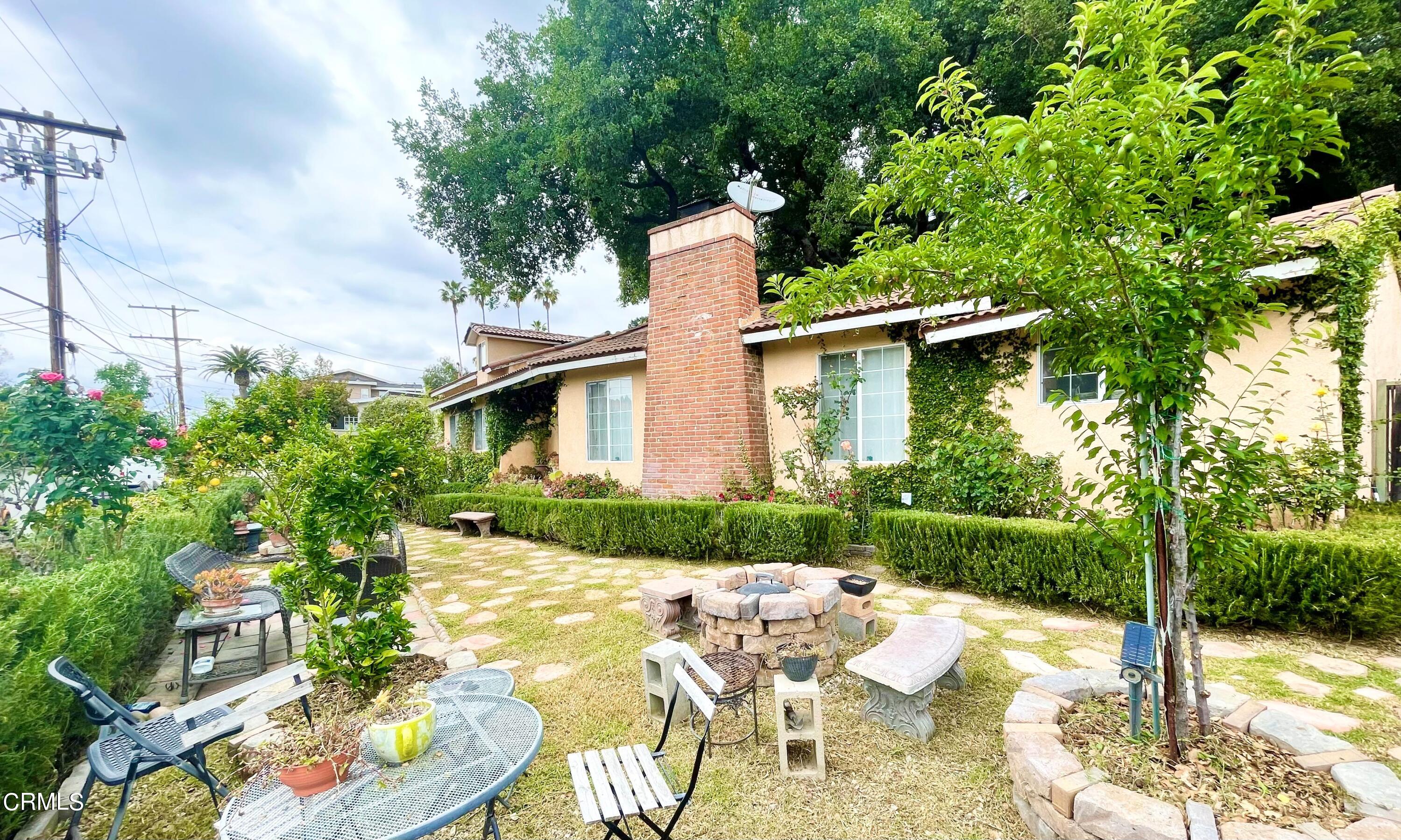 930 Sherlock Drive Burbank, CA 91501 - Photo 8 of 21 a view of a house with yard and sitting area