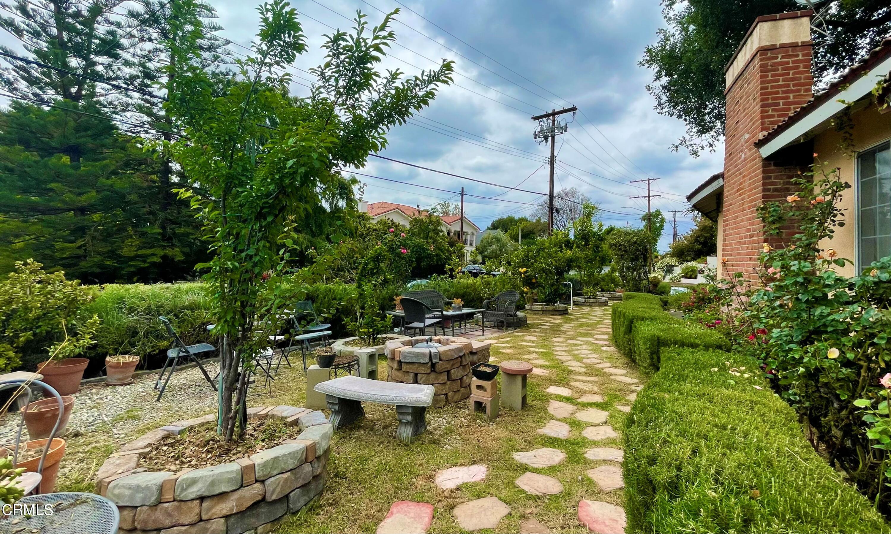 930 Sherlock Drive Burbank, CA 91501 - Photo 9 of 21 a swimming pool with lots of green space