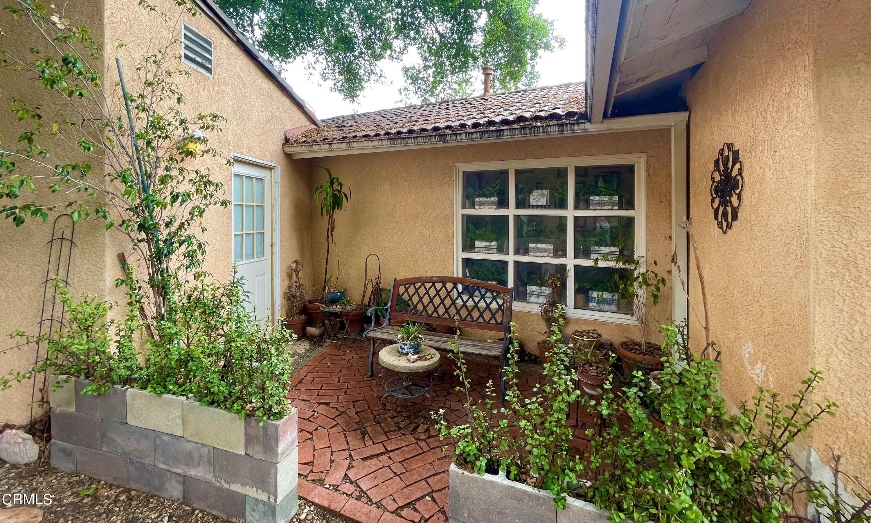 930 Sherlock Drive Burbank, CA 91501 - Photo 10 of 21 a front view of a house with a yard