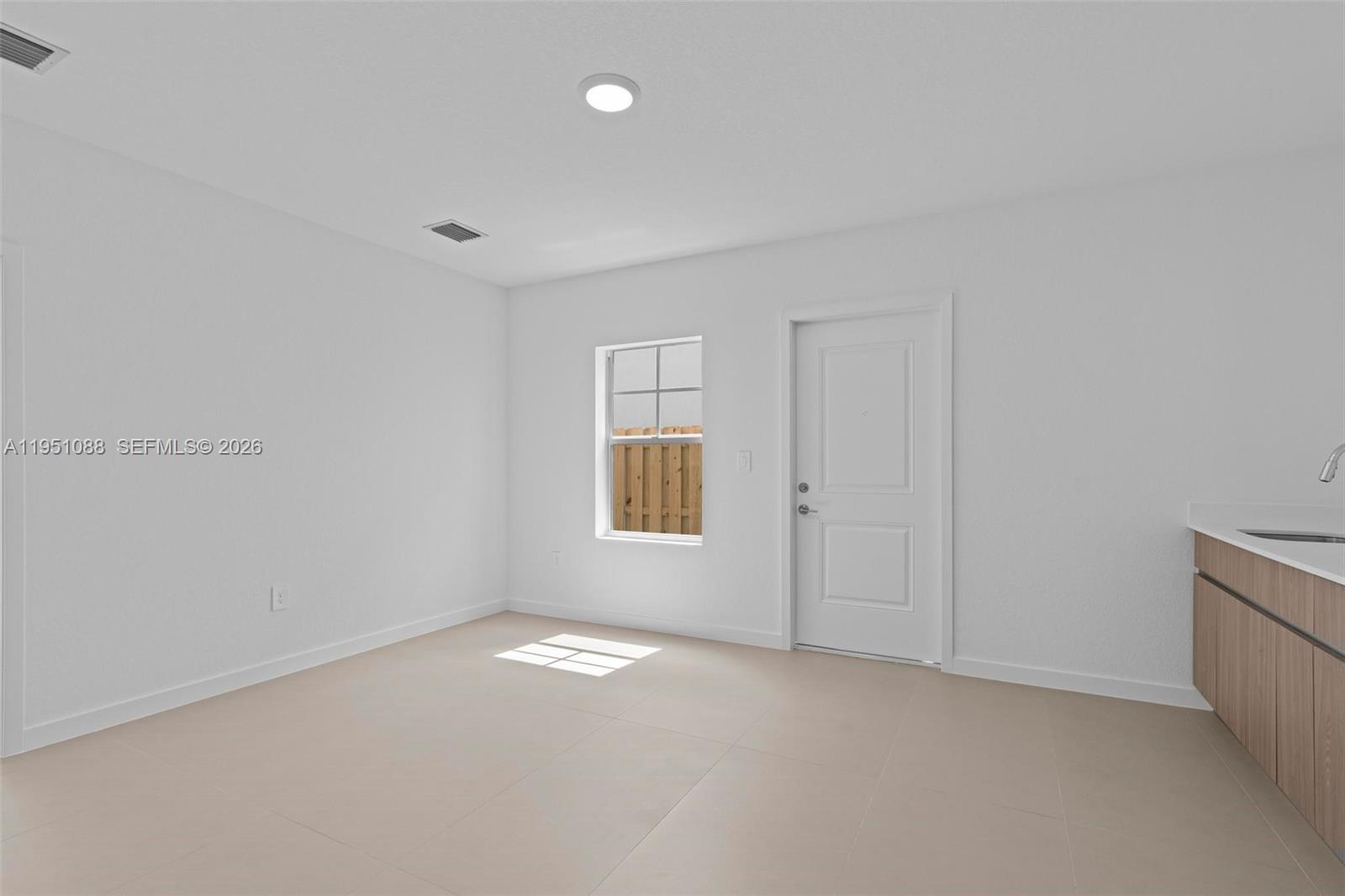 13350 Southwest 272nd Street Homestead, FL 33032 - Photo 14 of 35 an empty room with windows