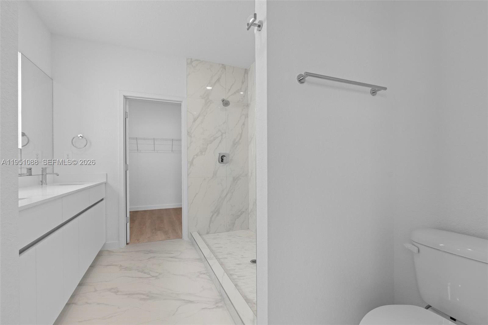 13350 Southwest 272nd Street Homestead, FL 33032 - Photo 25 of 35 a bathroom with a sink toilet and shower