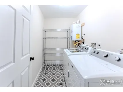 a bathroom with a sink a mirror and shower