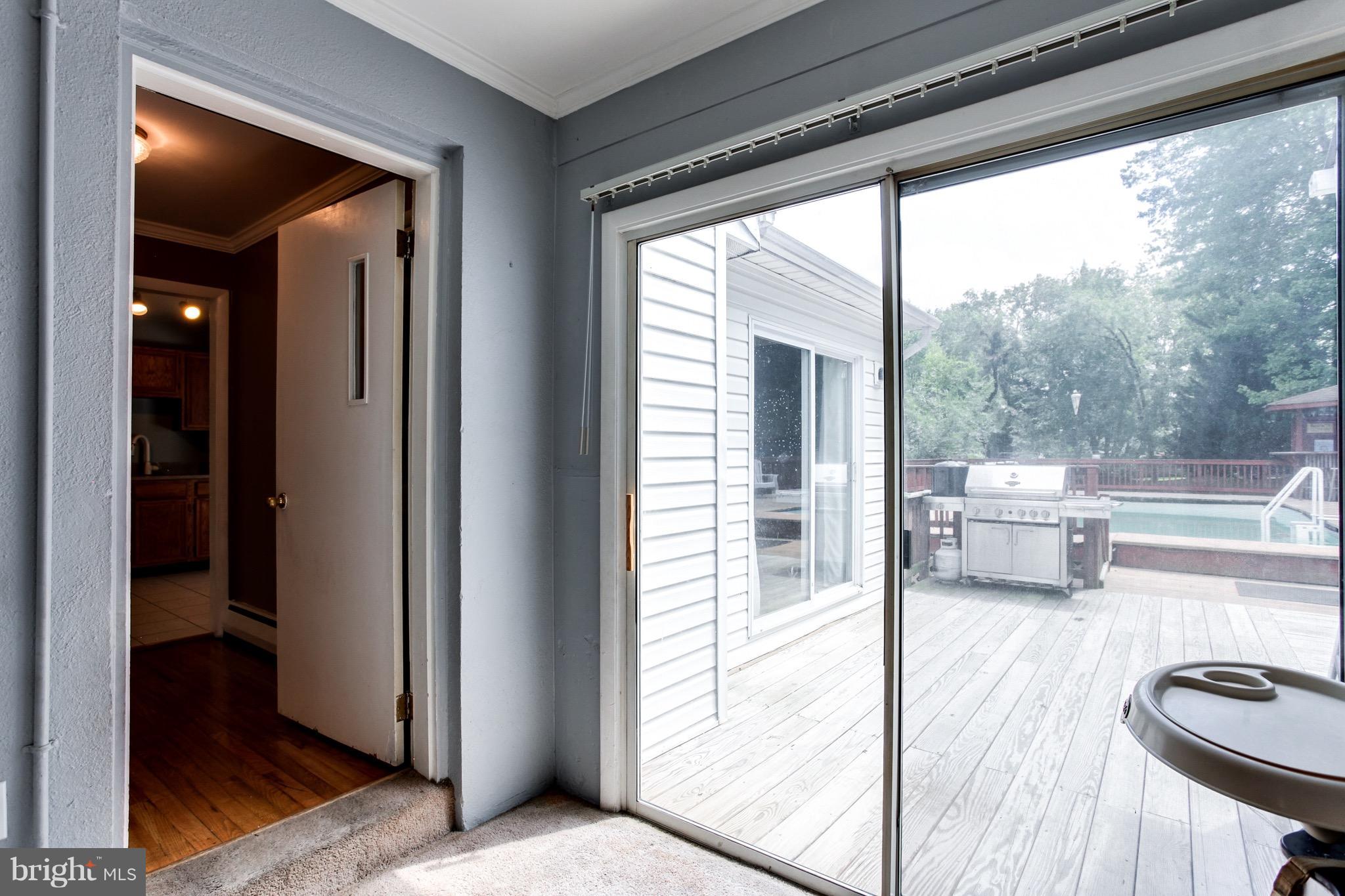 909 Mayo Road Edgewater, MD 21037 - Photo 21 of 29 Bonus/play room leads to deck and swimming pool