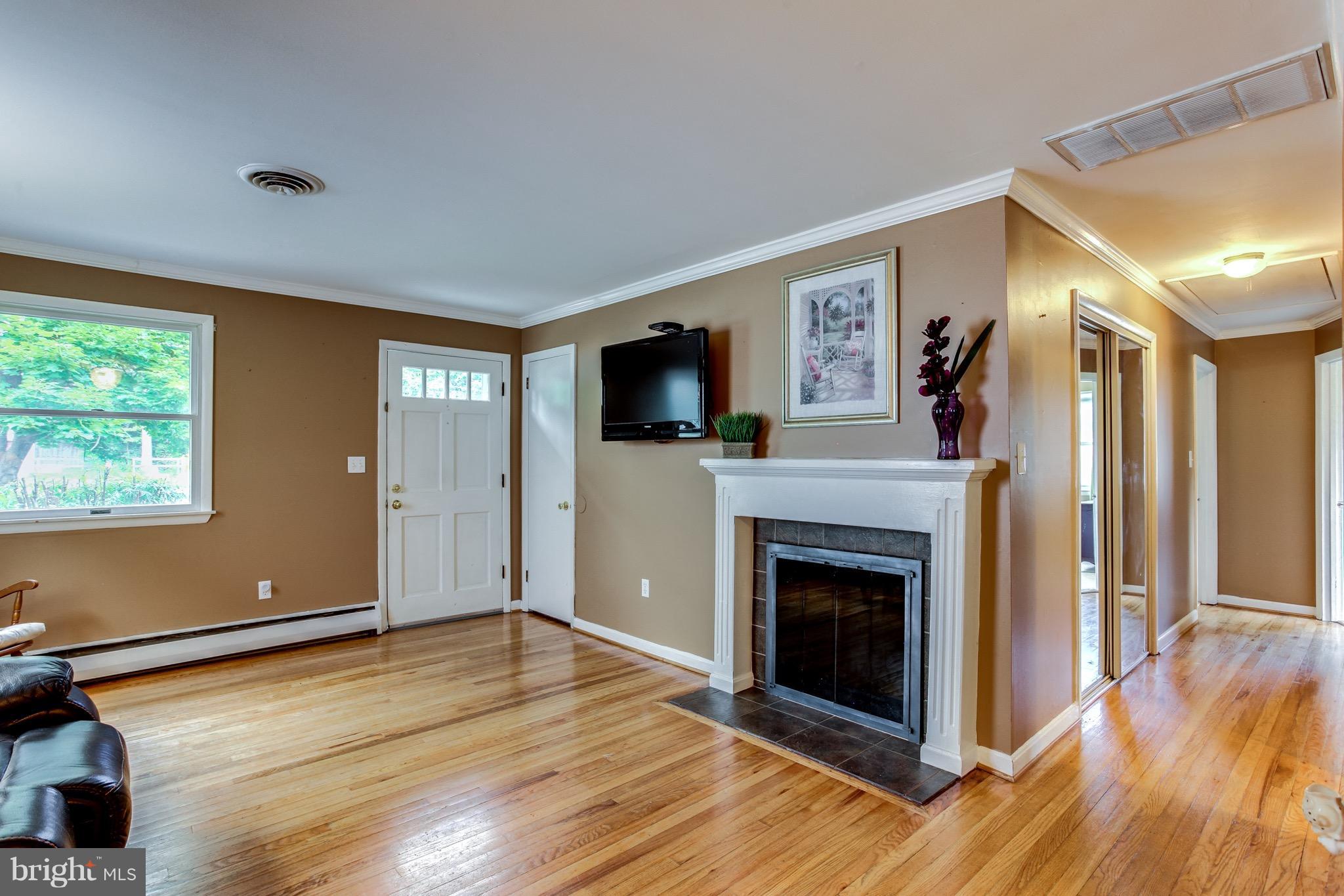 909 Mayo Road Edgewater, MD 21037 - Photo 4 of 29 Beautiful hardwood floors, woodburning fireplace