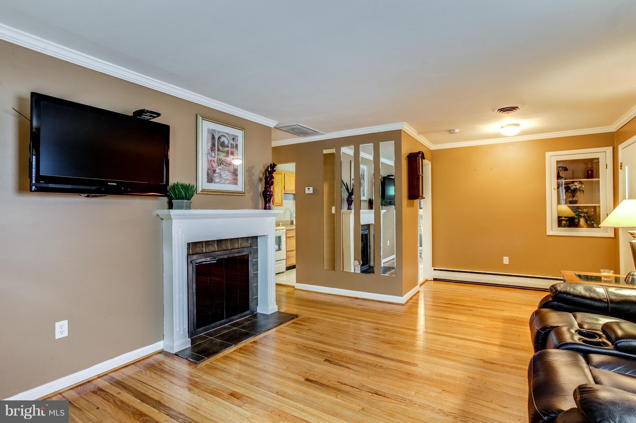 909 Mayo Road Edgewater, MD 21037 - Photo 5 of 29 Formal Living Room with woodburning fireplace