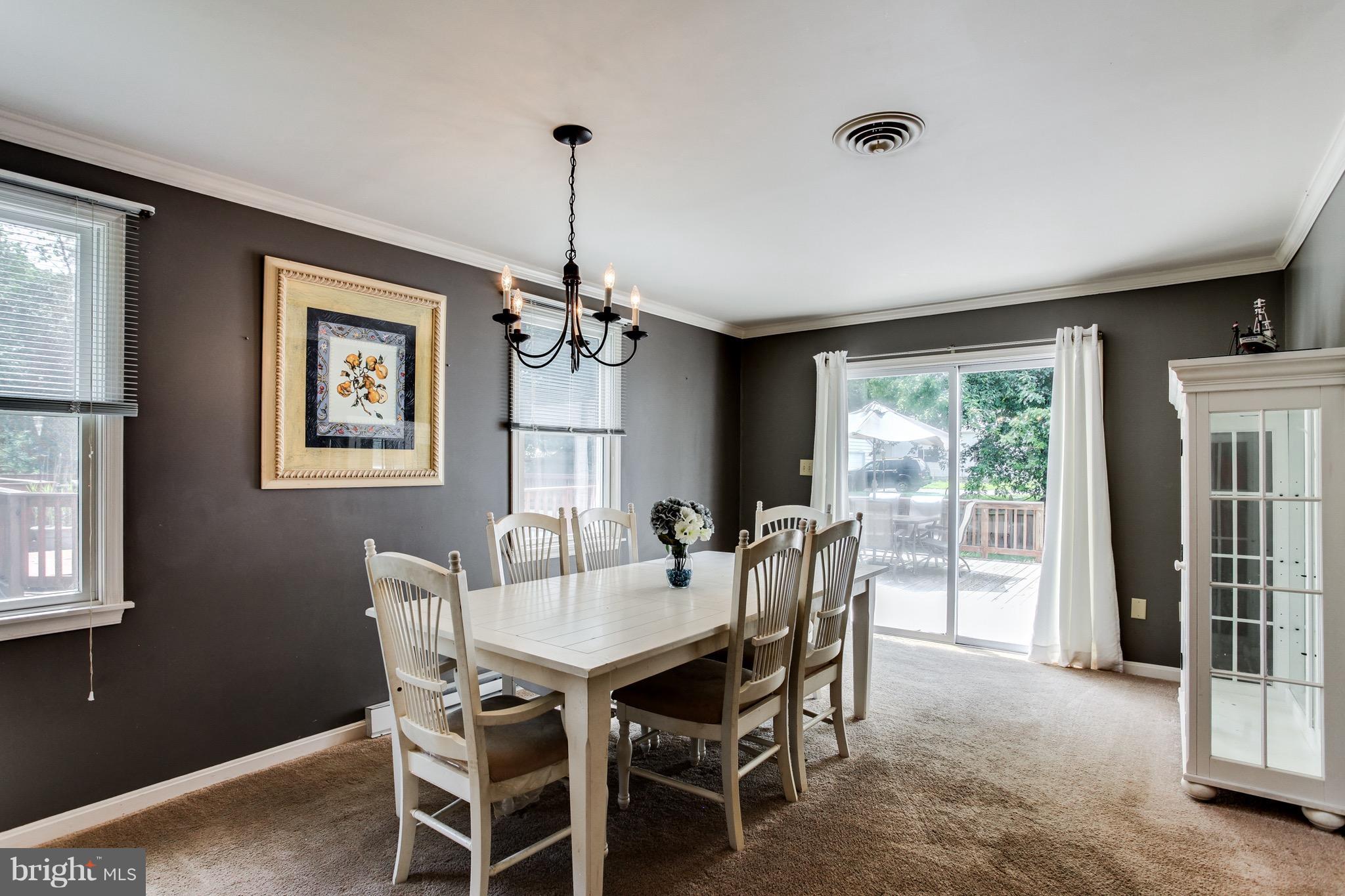 909 Mayo Road Edgewater, MD 21037 - Photo 8 of 29 Dining room with sliders to deck and gas grill