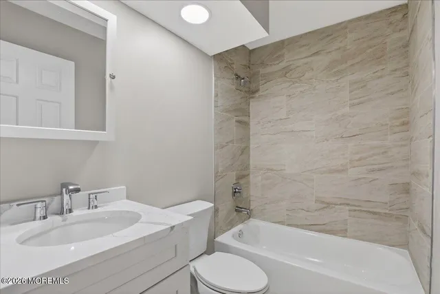 a bathroom with a sink toilet and bathtub