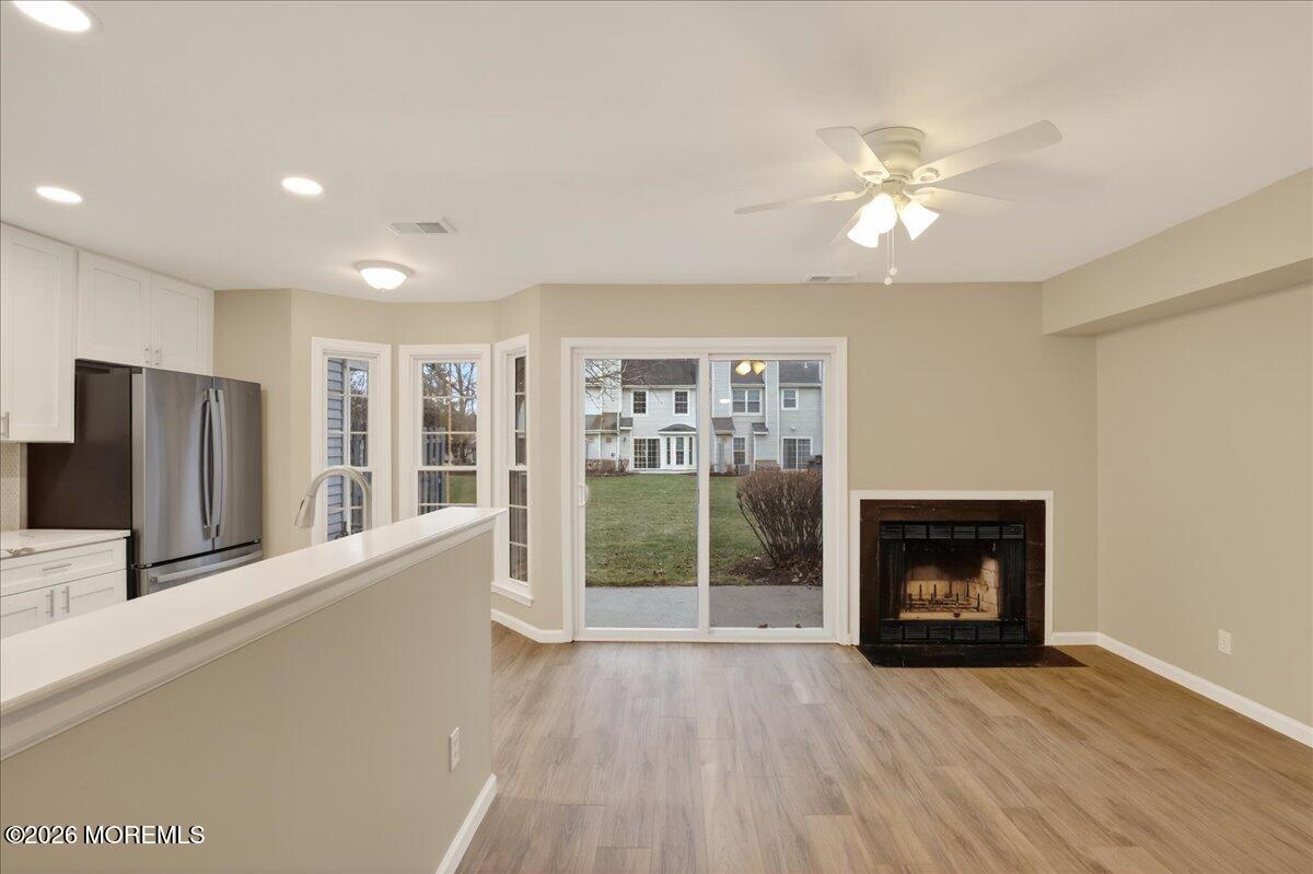 251 Sugar Maple Court, Unit 251 Howell, NJ 07731 - Photo 10 of 39 10-Family Room and Kitchen