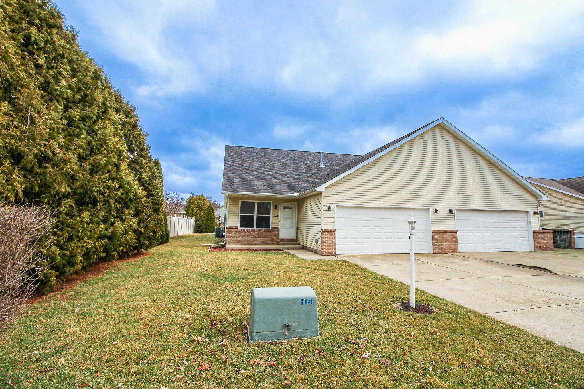 a backyard of a house with yard and outdoor seating