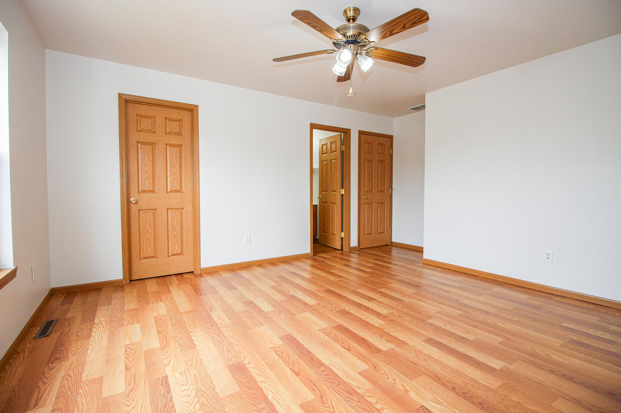 1709 Daisy Street Southeast De Motte, IN 46310 - Photo 12 of 19 a view of empty room with wooden floor and fan