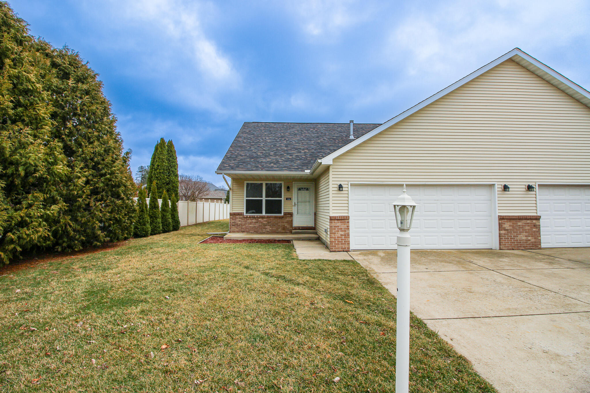 1709 Daisy Street Southeast De Motte, IN 46310 - Photo 2 of 19 a front view of house with yard and trees in the background