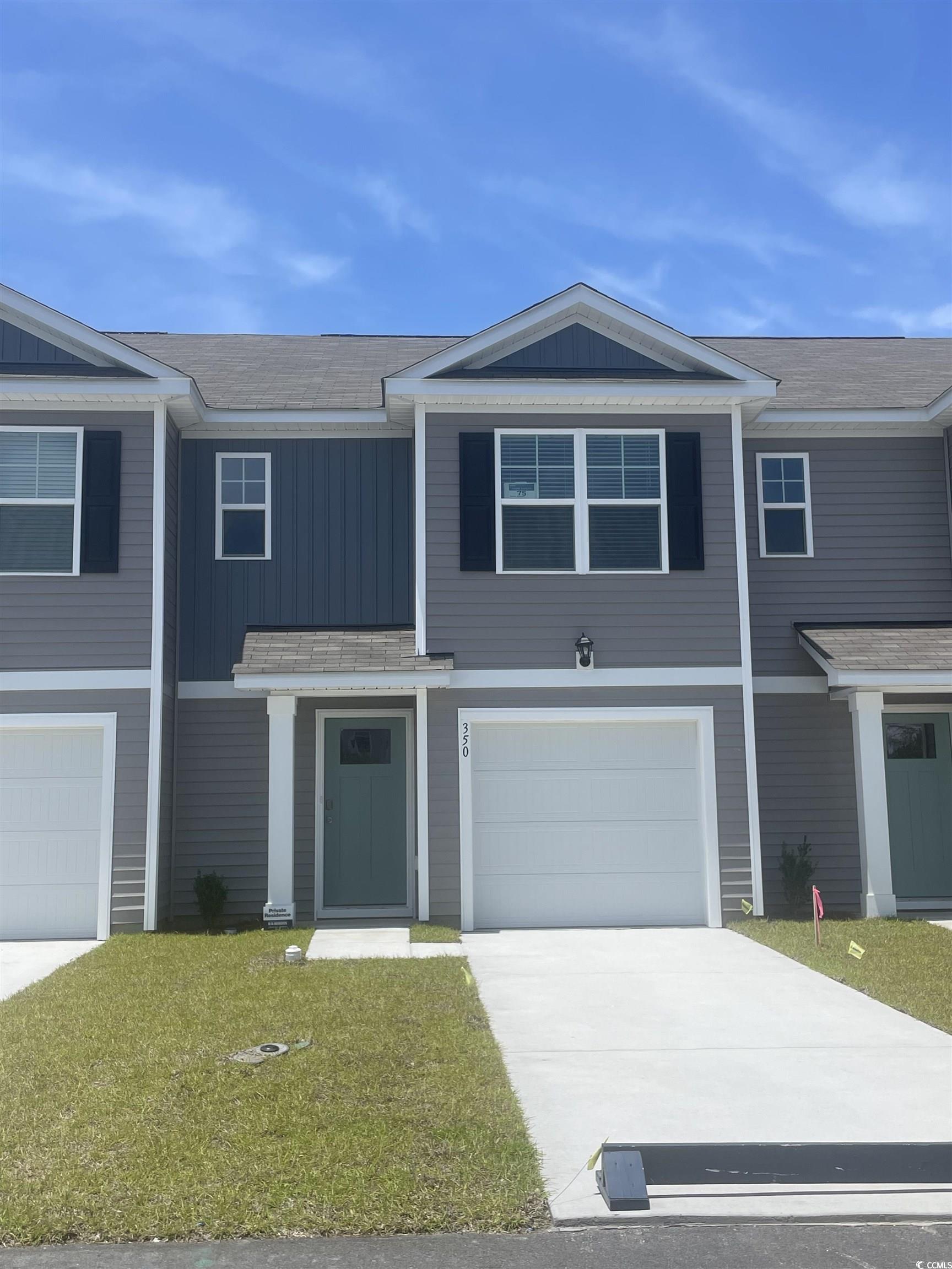 350 Bayou Loop, Unit LOT 75 Surfside Beach, SC 29575 - Photo 1 of 17 View of front of home featuring driveway, a garage