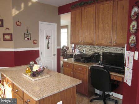 16501 Telescope Lane Dumfries, VA 22026 - Photo 13 of 30 a view of a workspace with furniture