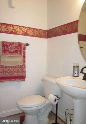 16501 Telescope Lane Dumfries, VA 22026 - Photo 14 of 30 a bathroom with a sink and a toilet