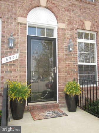16501 Telescope Lane Dumfries, VA 22026 - Photo 3 of 30 a front view of a house with a potted plant