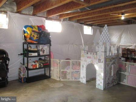 16501 Telescope Lane Dumfries, VA 22026 - Photo 24 of 30 a view of store room with refrigerator and ceiling fan