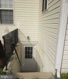 16501 Telescope Lane Dumfries, VA 22026 - Photo 29 of 30 a view of house with wooden floor and windows