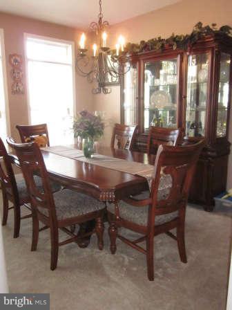 16501 Telescope Lane Dumfries, VA 22026 - Photo 6 of 30 a view of a dining room with furniture window and outside view