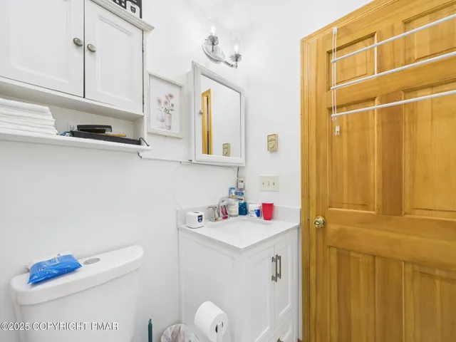 a bedroom with a bed and a cabinets
