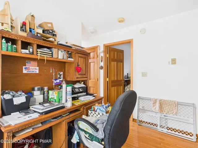 a utility room with a refrigerator and washer
