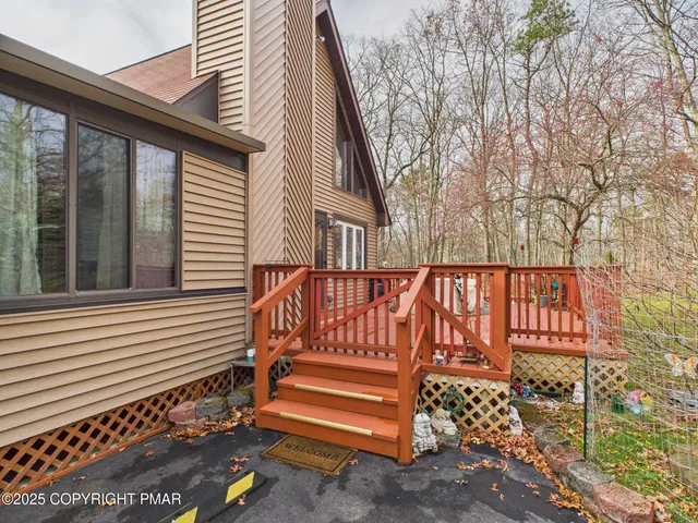 a view of a house with backyard porch and sitting area
