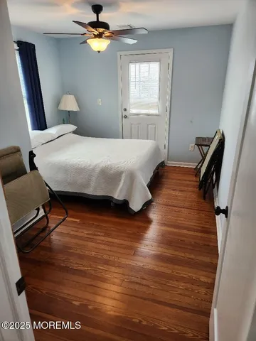 a bedroom with bed and window