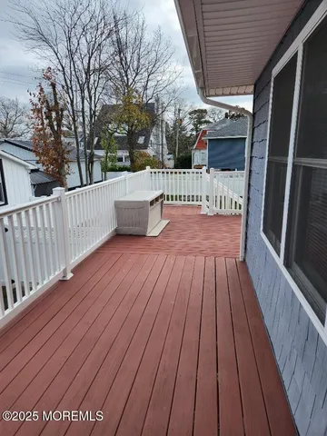 a view of a wooden deck with a bench