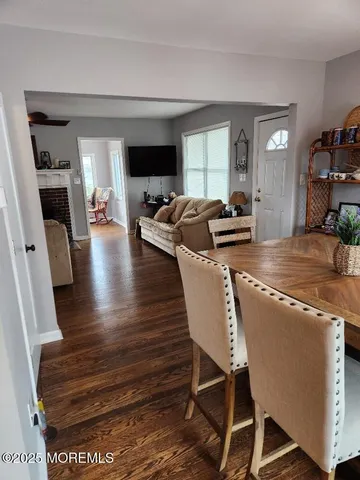 a living room with fireplace furniture and a flat screen tv