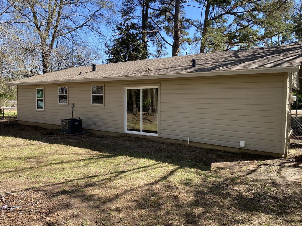203 Elam Street Mansfield, LA 71052 - Photo 15 of 17 Rear view of house with a shingled roof