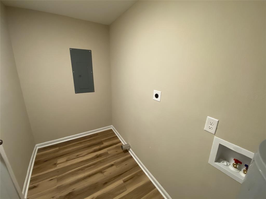 203 Elam Street Mansfield, LA 71052 - Photo 15 of 18 a view of a room with wooden floor and small window
