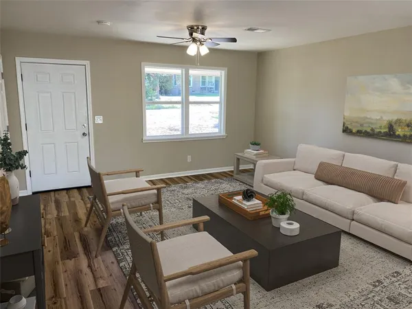 a living room with furniture and a window