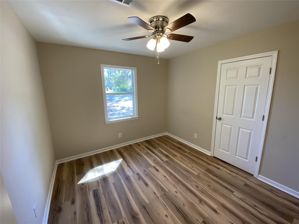 203 Elam Street Mansfield, LA 71052 - Photo 6 of 18 a view of an empty room and window