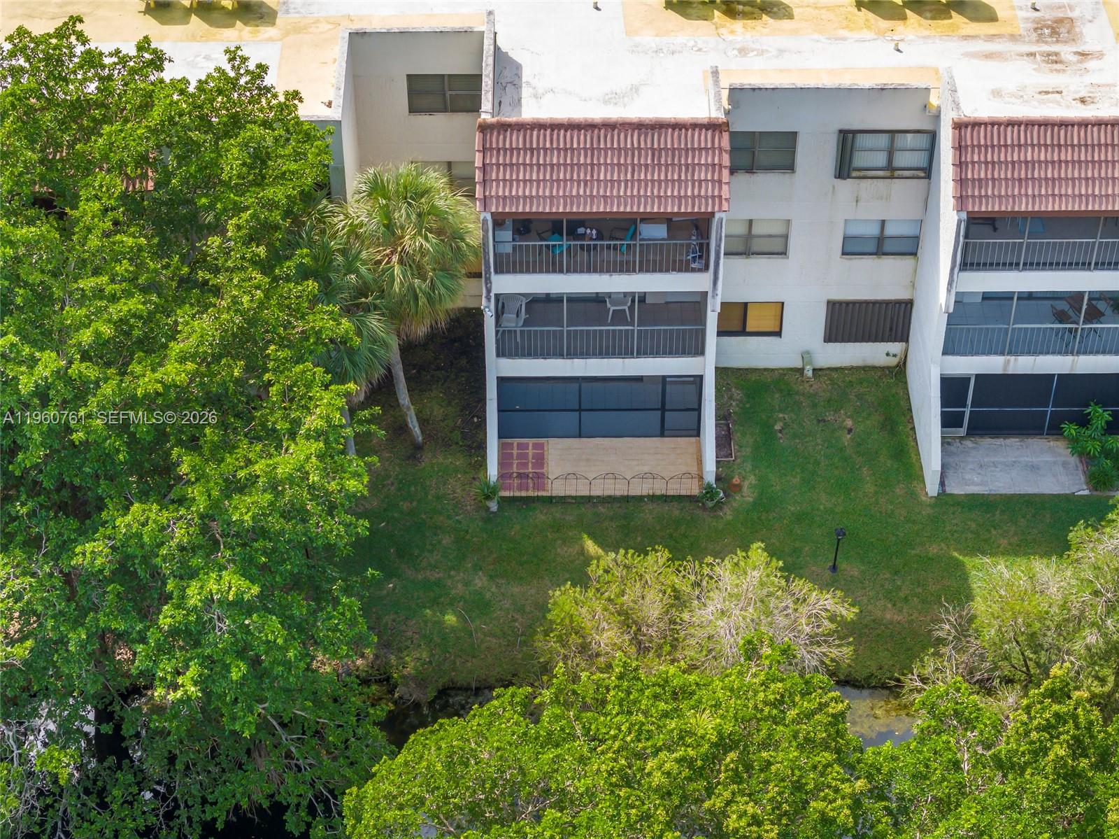 301 Racquet Club Road, Unit 103 Weston, FL 33326 - Photo 18 of 20 Bottom Floor with garden patio