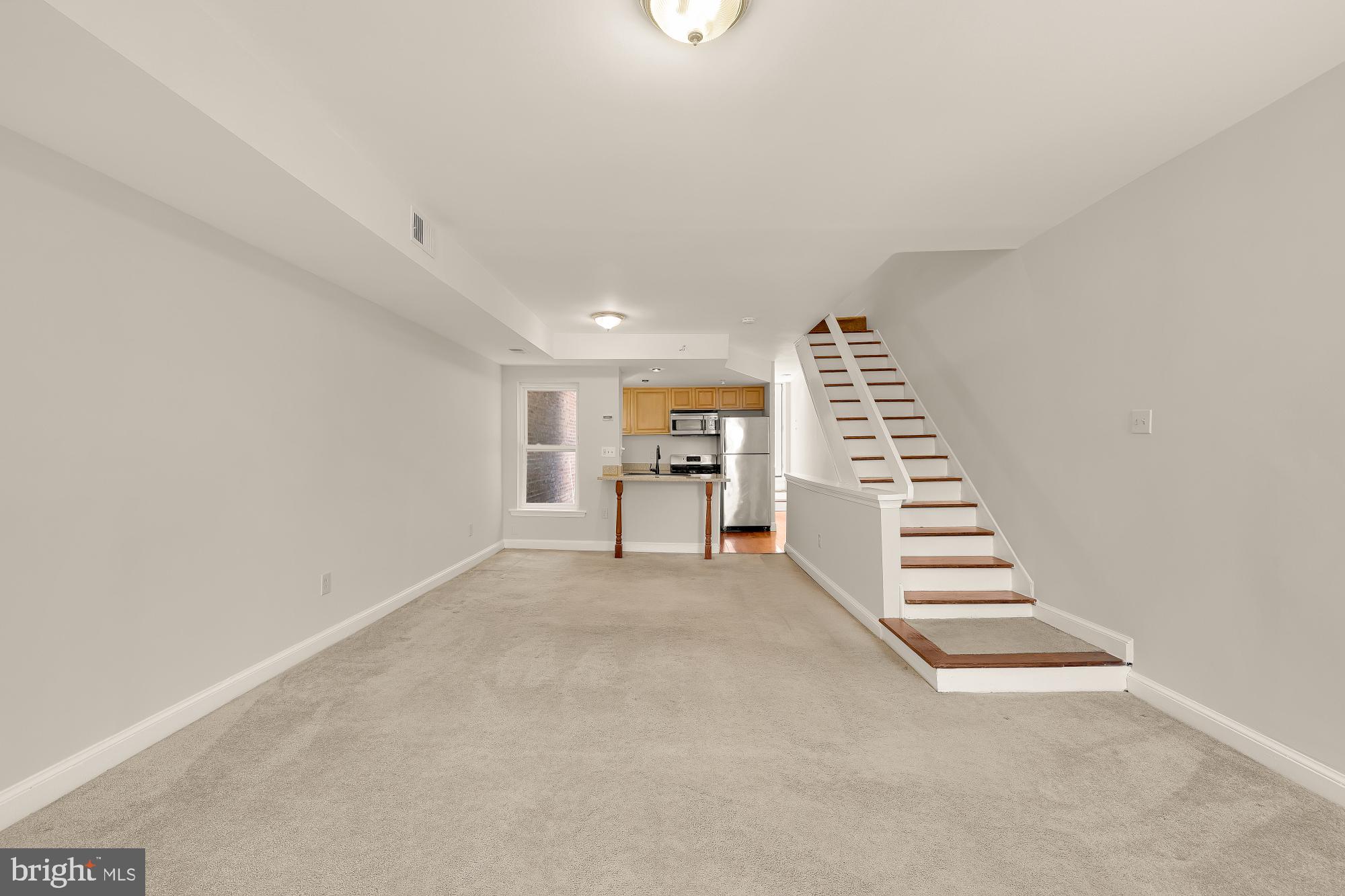 601 L Street Northeast Washington, DC 20002 - Photo 31 of 47 a view of an empty room with stairs and a window