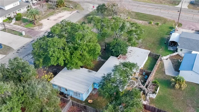 an aerial view of a house with outdoor space