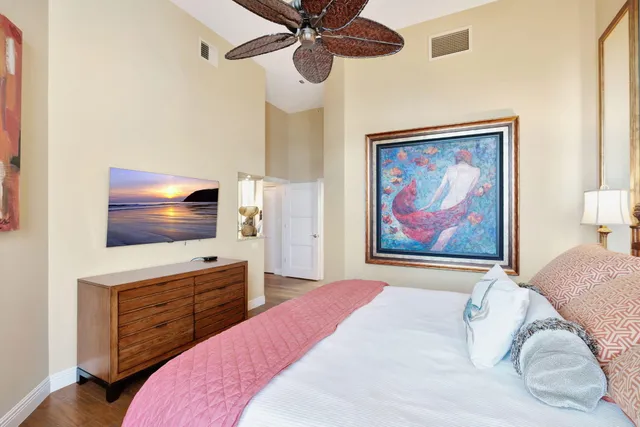 a bathroom with a granite countertop sink a mirror and a shower