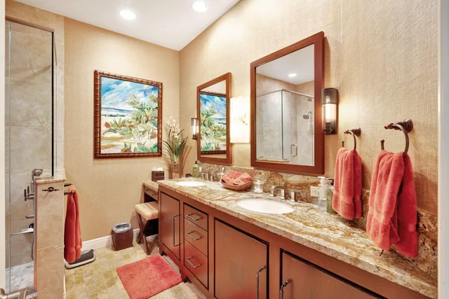 a bathroom with a granite countertop sink toilet and bathtub