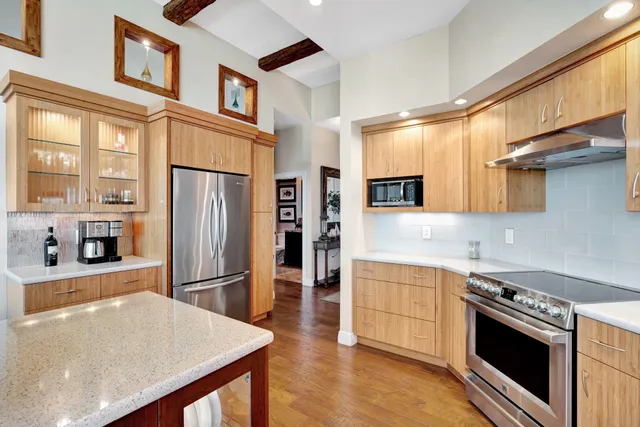 a view of a chairs and table in the balcony