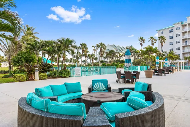 a living room with fireplace furniture and a chandelier