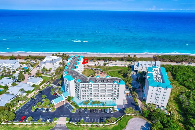 an aerial view of a house with yard swimming pool and outdoor seating