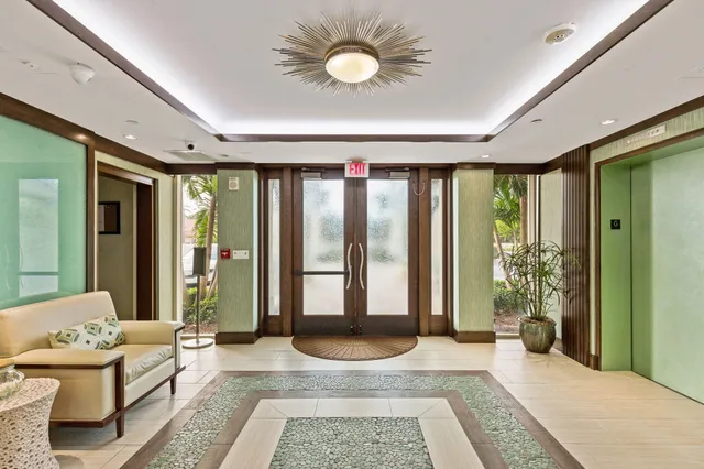 a spacious bedroom with a balcony a large bed and a large window