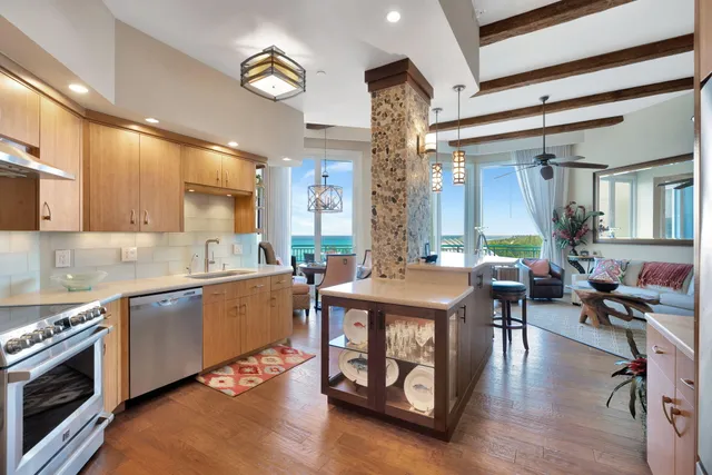 a kitchen with a stove a sink and a refrigerator