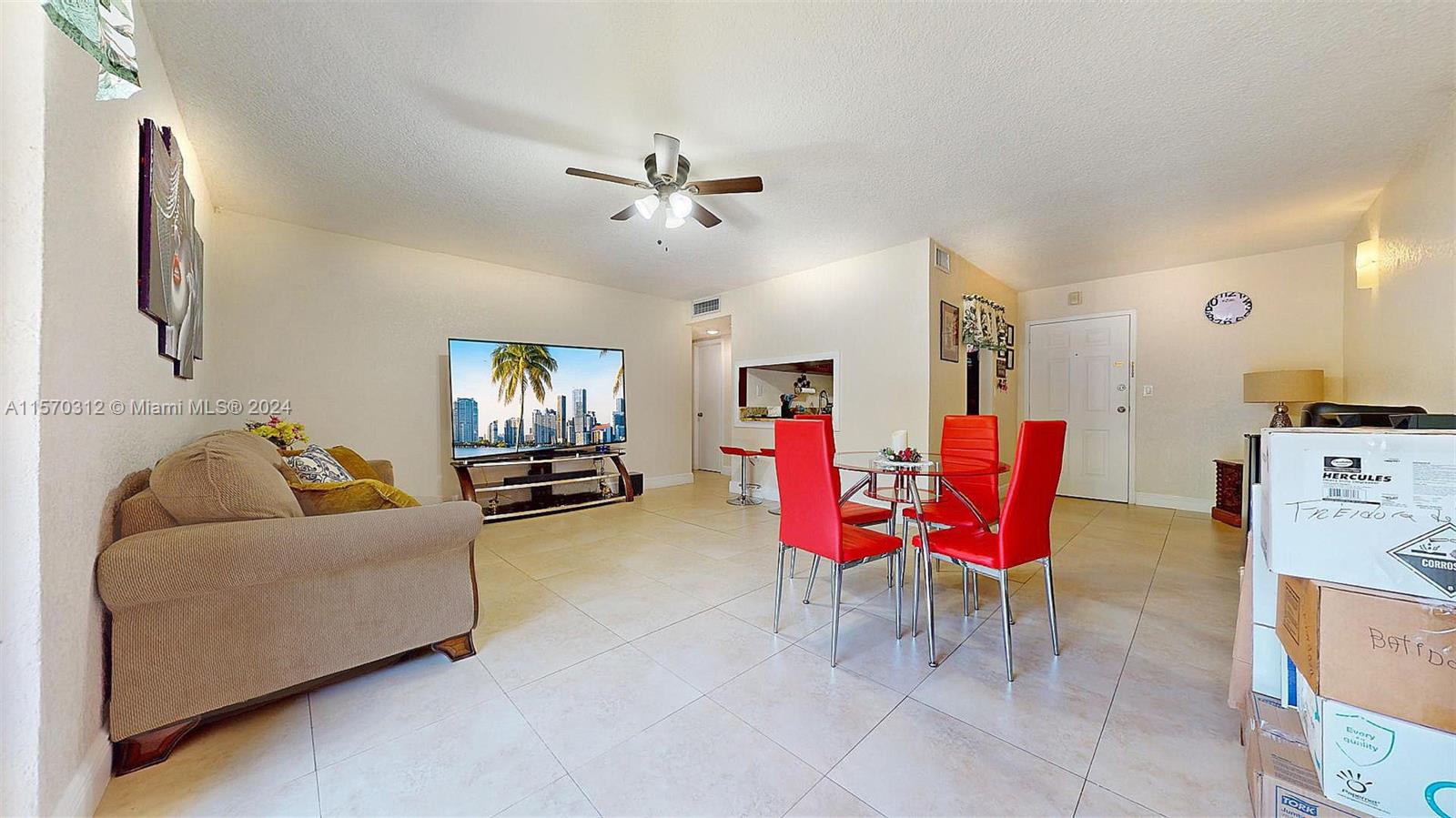 9483 Southwest 76th Street, Unit N3 Miami, FL 33173 - Photo 13 of 27 a living room with furniture and wooden floor