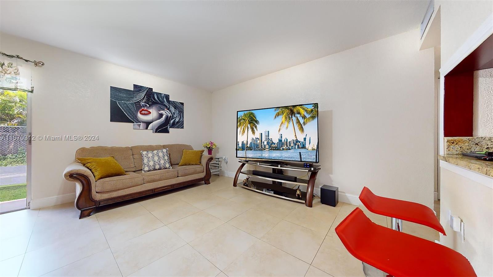 9483 Southwest 76th Street, Unit N3 Miami, FL 33173 - Photo 16 of 27 a living room with furniture a couch and a flat screen tv